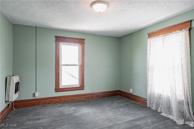 1407 Andrew St, Parkersburg, WV 26101 - carpeted empty room featuring heating unit and a textured ceiling