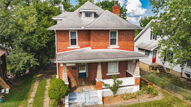 1407 Andrew St, Parkersburg, WV 26101 - traditional style home with a porch, a chimney, brick siding, and roof with shingles