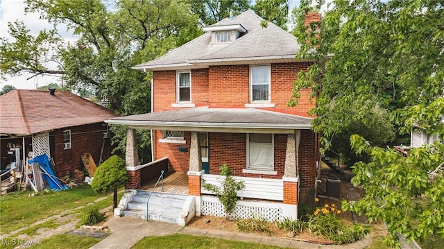 1407 Andrew St, Parkersburg, WV 26101 - american foursquare style home with covered porch, a chimney, brick siding, and a shingled roof