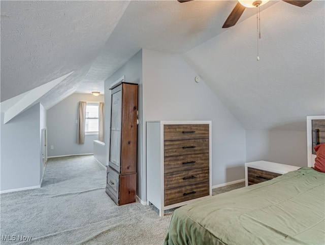 14507 Reddington Ave, Maple Heights, OH 44137 - bedroom featuring a textured ceiling, vaulted ceiling, carpet flooring, and a ceiling fan