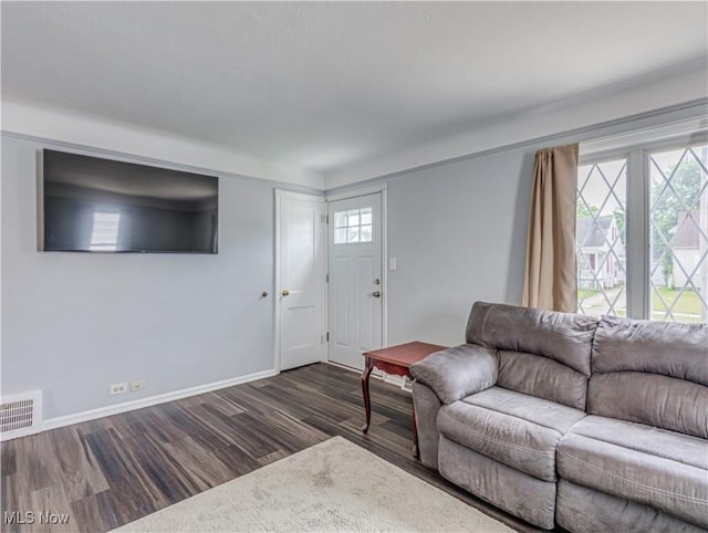 14507 Reddington Ave, Maple Heights, OH 44137 - living room featuring dark wood-style floors and baseboards