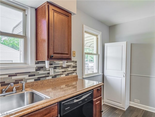 14507 Reddington Ave, Maple Heights, OH 44137 - kitchen featuring dishwasher, decorative backsplash, dark wood-type flooring, and brown cabinetry