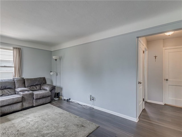 14507 Reddington Ave, Maple Heights, OH 44137 - living area with dark wood-style flooring and baseboards