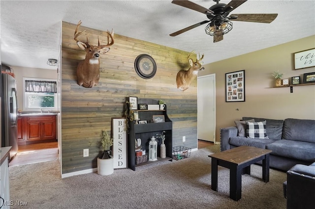 1300 Andrew Ave, Salem, OH 44460 - living area featuring wood walls, a textured ceiling, a ceiling fan, and carpet