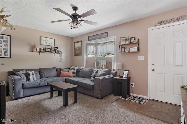1300 Andrew Ave, Salem, OH 44460 - living room with ceiling fan, carpet flooring, and a textured ceiling