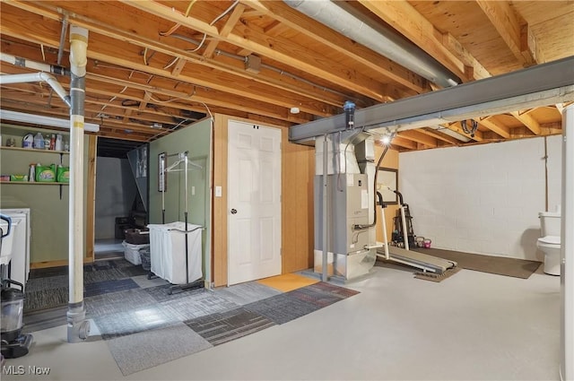 1300 Andrew Ave, Salem, OH 44460 - unfinished basement featuring heating unit, washer and dryer, and concrete block wall