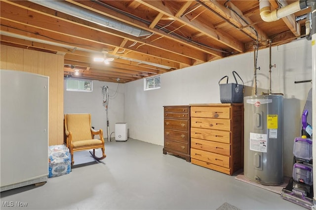 1300 Andrew Ave, Salem, OH 44460 - below grade area featuring electric water heater and freestanding refrigerator