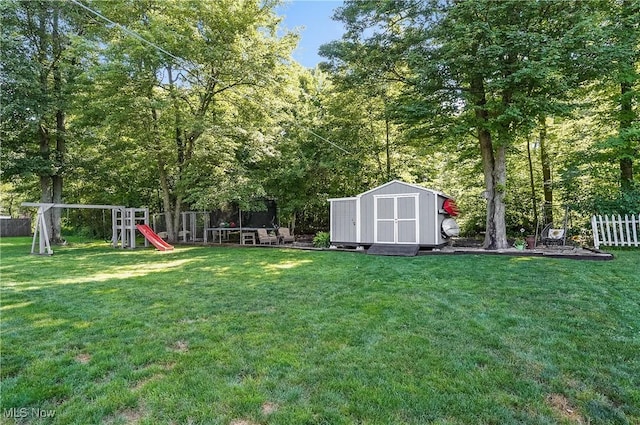 1300 Andrew Ave, Salem, OH 44460 - fenced backyard featuring a shed and a playground