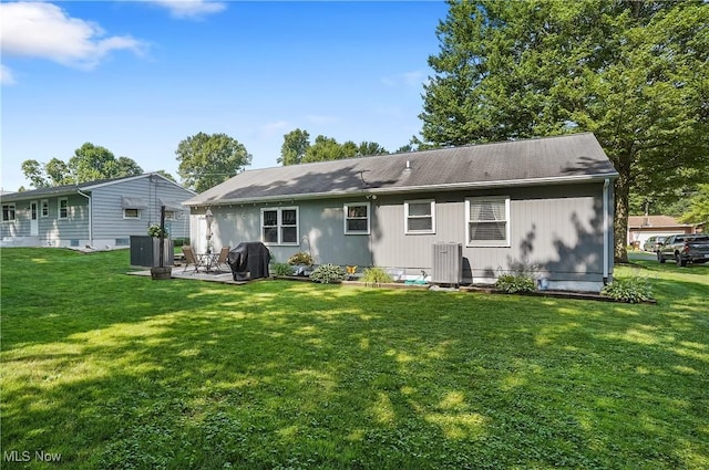 1300 Andrew Ave, Salem, OH 44460 - back of property featuring a patio area and a lawn