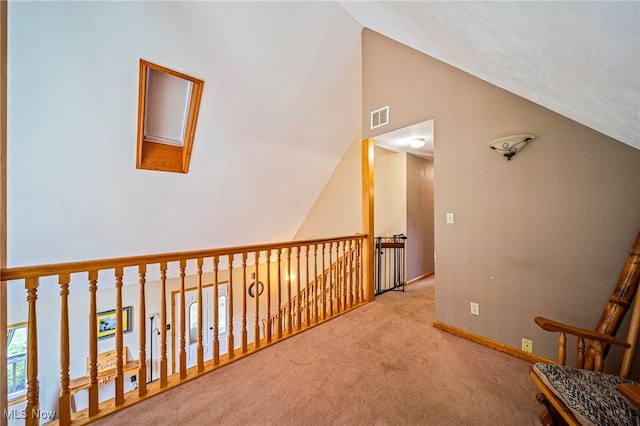 5050 Middle Rd, Conneaut, OH 44030 - hall with carpet floors and high vaulted ceiling