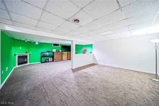 5050 Middle Rd, Conneaut, OH 44030 - finished below grade area featuring carpet floors, a paneled ceiling, and a fireplace