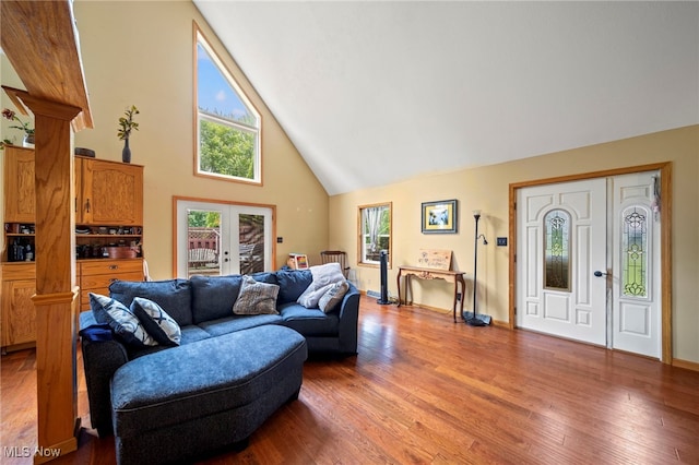 5050 Middle Rd, Conneaut, OH 44030 - living area featuring high vaulted ceiling, wood finished floors, and french doors
