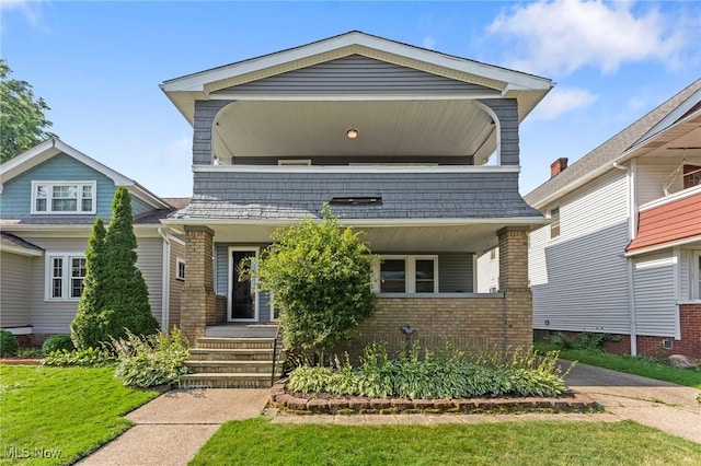 14317-14319 Bayes Ave, Lakewood, OH 44107 - view of front of house featuring brick siding and a balcony