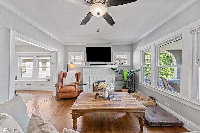 14317-14319 Bayes Ave, Lakewood, OH 44107 - living room with a fireplace, wood finished floors, crown molding, and a ceiling fan