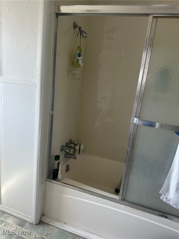 1720 Spring St, Parkersburg, WV 26101 - bathroom with enclosed tub / shower combo and tile patterned flooring
