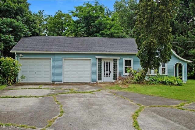 45 Mechanic St, Berlin Heights, OH 44814 - garage featuring asphalt driveway