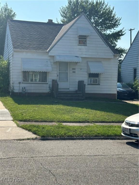 5256 W 52nd St, Parma, OH 44134 - bungalow featuring a front yard and a shingled roof