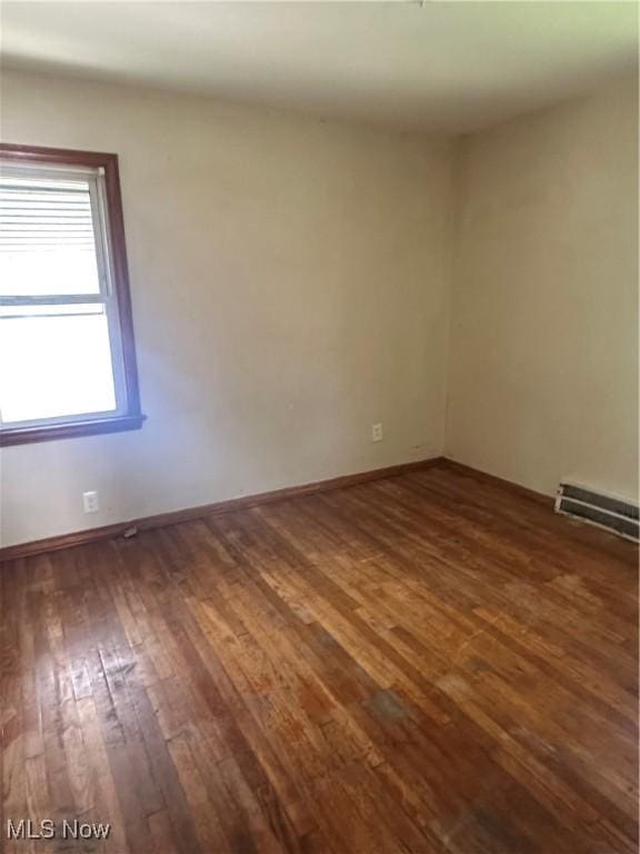 5252 W 45th St, Parma, OH 44134 - unfurnished room featuring dark wood-type flooring and baseboard heating