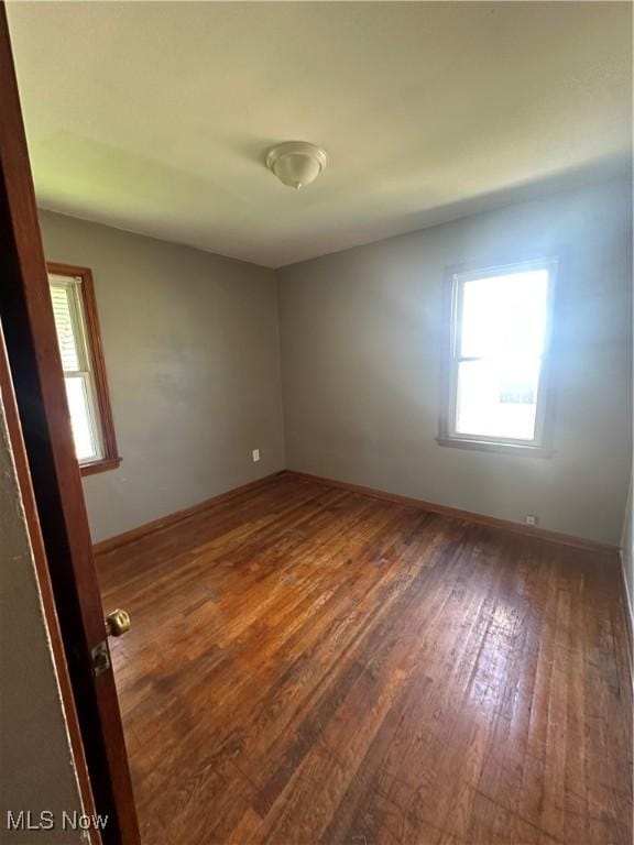 5252 W 45th St, Parma, OH 44134 - spare room featuring hardwood / wood-style flooring and healthy amount of natural light