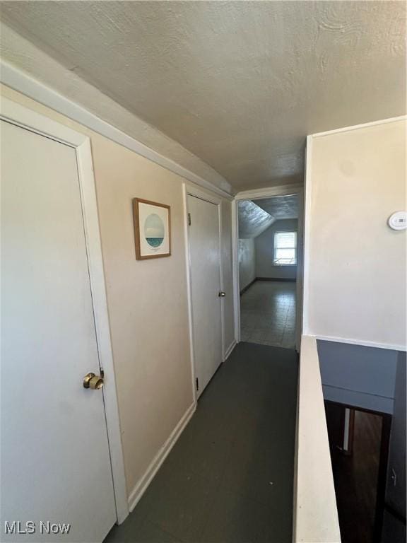 5252 W 45th St, Parma, OH 44134 - hallway with a textured ceiling and vaulted ceiling