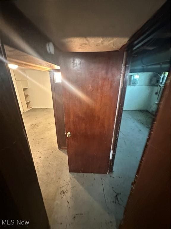 5252 W 45th St, Parma, OH 44134 - detailed view of unfinished concrete floors and a smoke detector