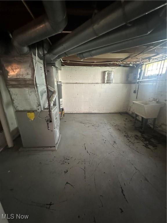 5252 W 45th St, Parma, OH 44134 - unfinished basement with a sink and heating unit