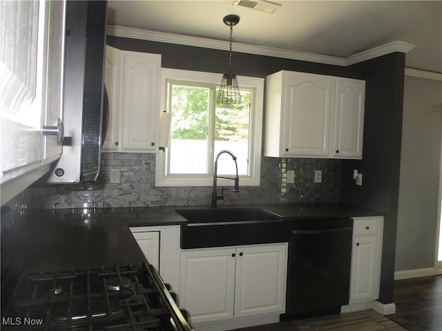 7527 Tamkrist Trl, Conneaut, OH 44030 - kitchen with dishwashing machine, dark countertops, white cabinets, and ornamental molding