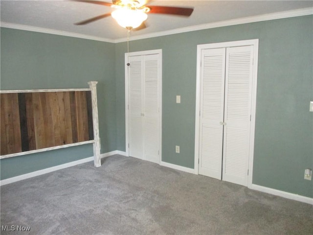 7527 Tamkrist Trl, Conneaut, OH 44030 - unfurnished bedroom with two closets, ornamental molding, carpet, and a ceiling fan