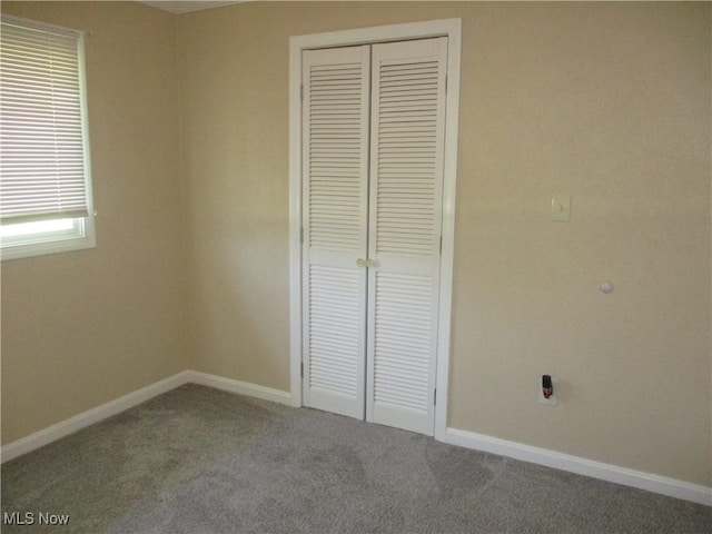 7527 Tamkrist Trl, Conneaut, OH 44030 - unfurnished bedroom featuring a closet and carpet floors