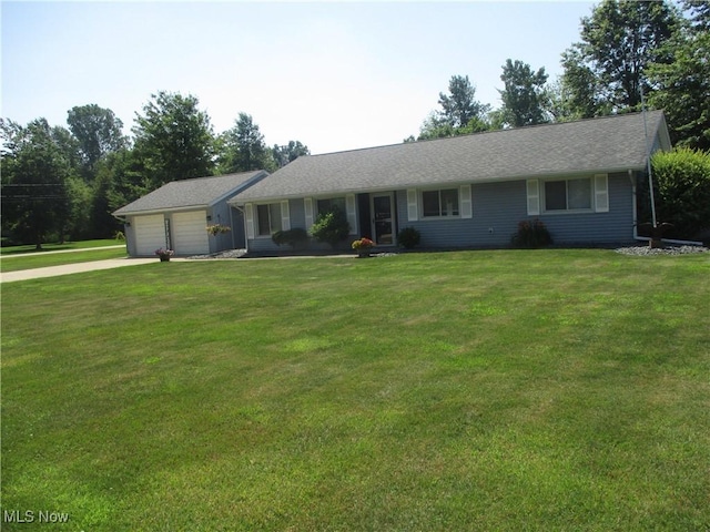 7527 Tamkrist Trl, Conneaut, OH 44030 - single story home with concrete driveway, a garage, and a front yard
