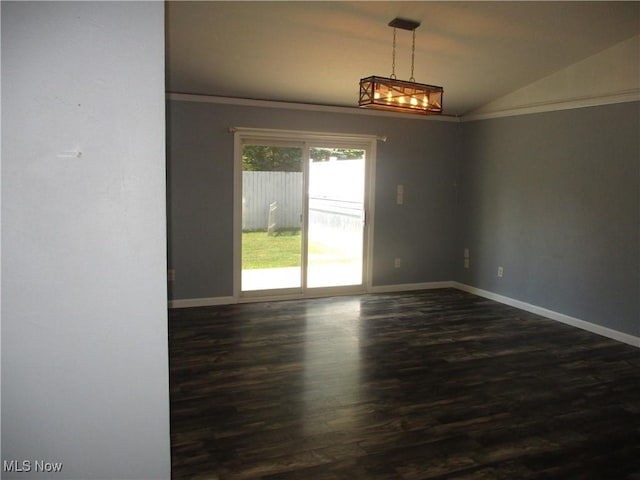 7527 Tamkrist Trl, Conneaut, OH 44030 - spare room with lofted ceiling, dark wood-type flooring, a chandelier, and ornamental molding
