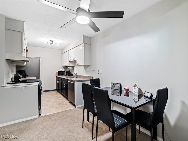 8455 N Akins Rd Unit 103, North Royalton, OH 44133 - dining space with a ceiling fan and light carpet