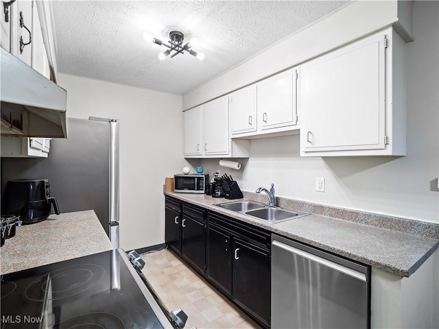 8455 N Akins Rd Unit 103, North Royalton, OH 44133 - kitchen featuring stainless steel appliances, white cabinets, a textured ceiling, under cabinet range hood, and dark cabinets