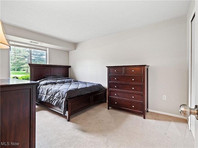 8455 N Akins Rd Unit 103, North Royalton, OH 44133 - bedroom with light carpet and baseboards