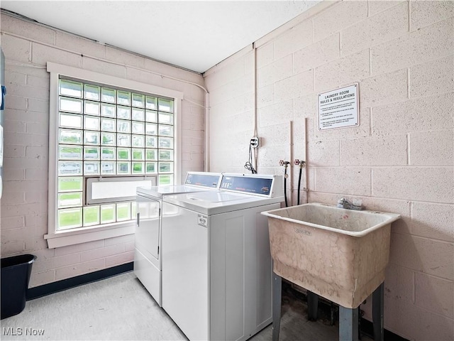 8455 N Akins Rd Unit 103, North Royalton, OH 44133 - shared laundry featuring washer and clothes dryer and concrete block wall