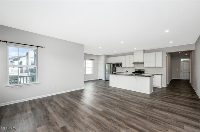 1637 Duncan Way, Streetsboro, OH 44241 - kitchen with stainless steel appliances, open floor plan, white cabinets, an island with sink, and dark wood-style floors