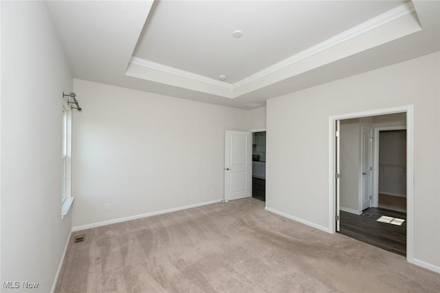 1637 Duncan Way, Streetsboro, OH 44241 - unfurnished bedroom with a tray ceiling, carpet floors, and crown molding