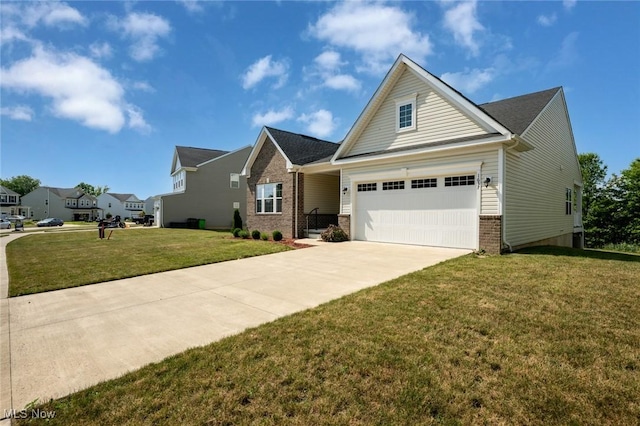 1637 Duncan Way, Streetsboro, OH 44241 - view of front of home featuring concrete driveway, brick siding, a front lawn, and an attached garage