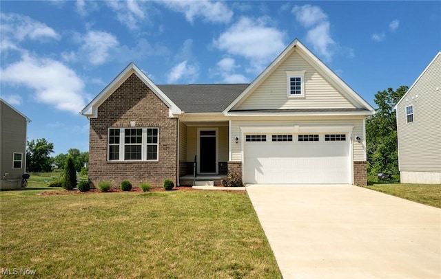 1637 Duncan Way, Streetsboro, OH 44241 - view of front of property featuring brick siding, a front yard, concrete driveway, and an attached garage
