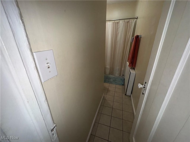 15610 Van Aken Blvd Unit 5, Shaker Heights, OH 44120 - hallway featuring light tile patterned floors and baseboards