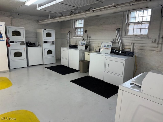 15610 Van Aken Blvd Unit 5, Shaker Heights, OH 44120 - community laundry room with separate washer and dryer, stacked washer and clothes dryer, and healthy amount of natural light