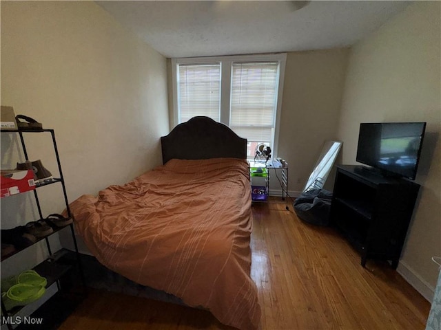 15610 Van Aken Blvd Unit 5, Shaker Heights, OH 44120 - bedroom featuring wood finished floors and baseboards