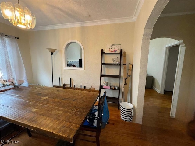 15610 Van Aken Blvd Unit 5, Shaker Heights, OH 44120 - dining area with wood finished floors, arched walkways, a chandelier, and crown molding