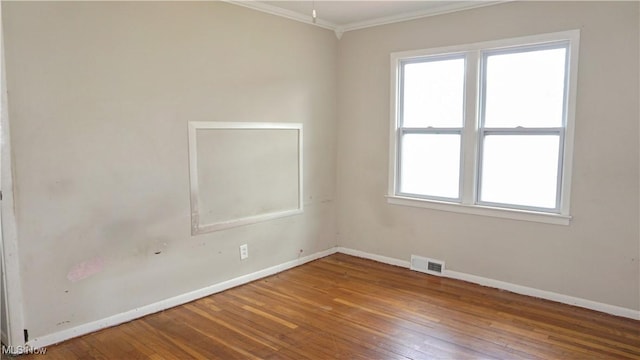 20737 Bowling Green Rd, Maple Heights, OH 44137 - unfurnished room featuring crown molding and hardwood / wood-style floors