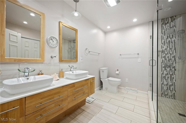 629-37 Fairington Oval, Aurora, OH 44202 - full bath with double vanity, a shower stall, and recessed lighting