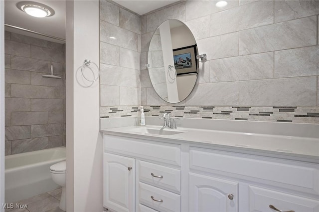 629-37 Fairington Oval, Aurora, OH 44202 - bathroom with vanity, tile patterned flooring, decorative backsplash, and bathtub / shower combination
