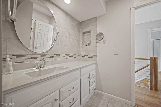 629-37 Fairington Oval, Aurora, OH 44202 - bathroom featuring vanity, tile patterned floors, and tasteful backsplash