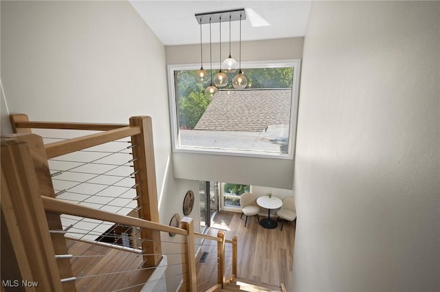 629-37 Fairington Oval, Aurora, OH 44202 - stairway featuring plenty of natural light and wood finished floors