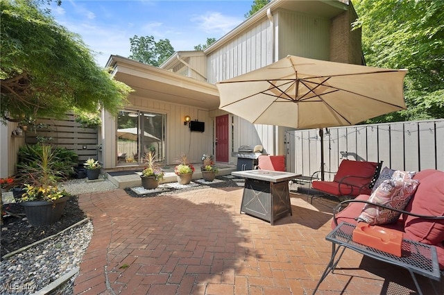 629-37 Fairington Oval, Aurora, OH 44202 - view of patio featuring area for grilling and an outdoor fire pit