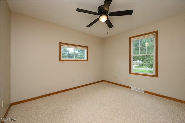103 Beech St, Doylestown, OH 44230 - empty room with light colored carpet and ceiling fan